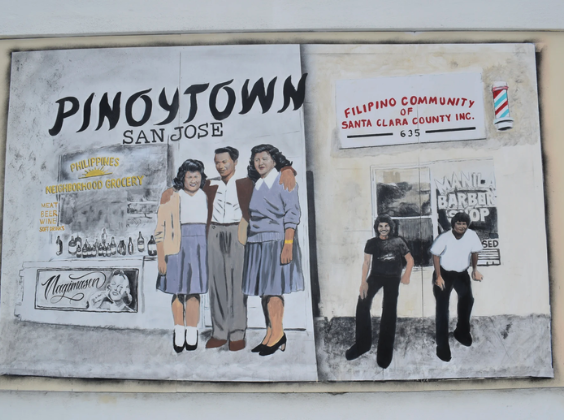 A colorful mural with paintings of various figures that says "Pinoytown San Jose" 