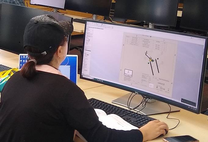 DMT Student Working on CAD Design in Lab