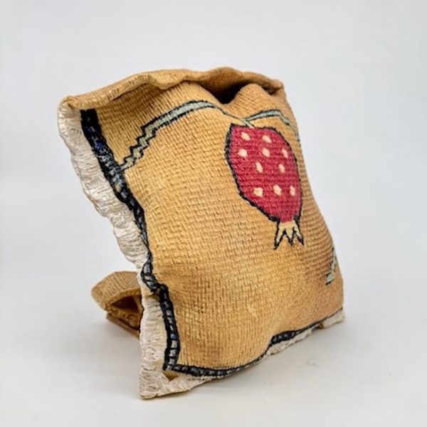 ceramic sculpture that looks like a knit bag