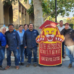 Custodial Staff behind DA Mascot